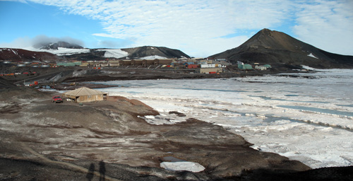 View across Winter Quarters Bay towards McMurdo Station in January 2009, with Scott's Discovery Hut at left.