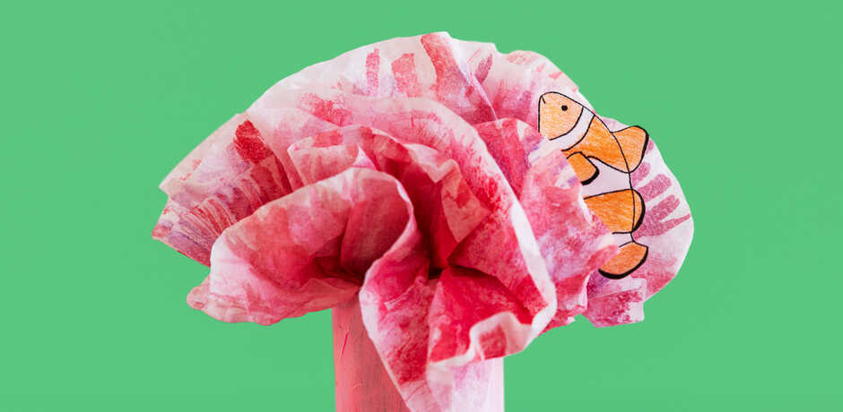 Paper clownfish craft in a tissue paper anemone