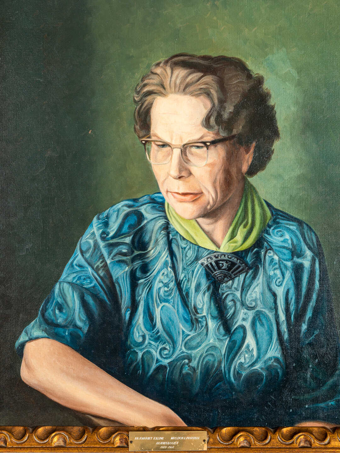 Oil painted portrait of Harriet Frizzell in a blue shirt with a green neck scarf and horn-rimmed glasses, staring seriously leftward. 