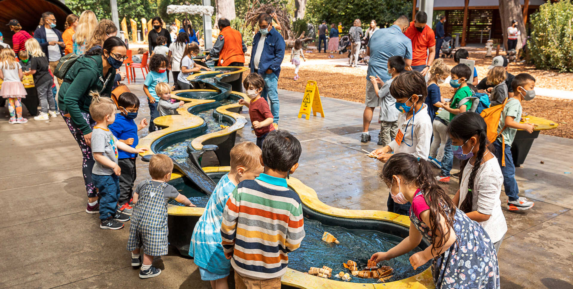 Kids playing at Riveropolis water table during Academy Spring Festival 