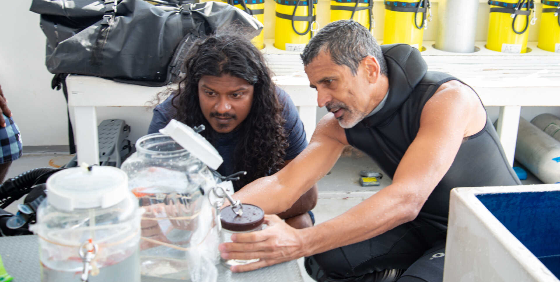 Academy curator Luiz Rocha and research partner Ahmed Najeeb examine a specimen in the Maldives