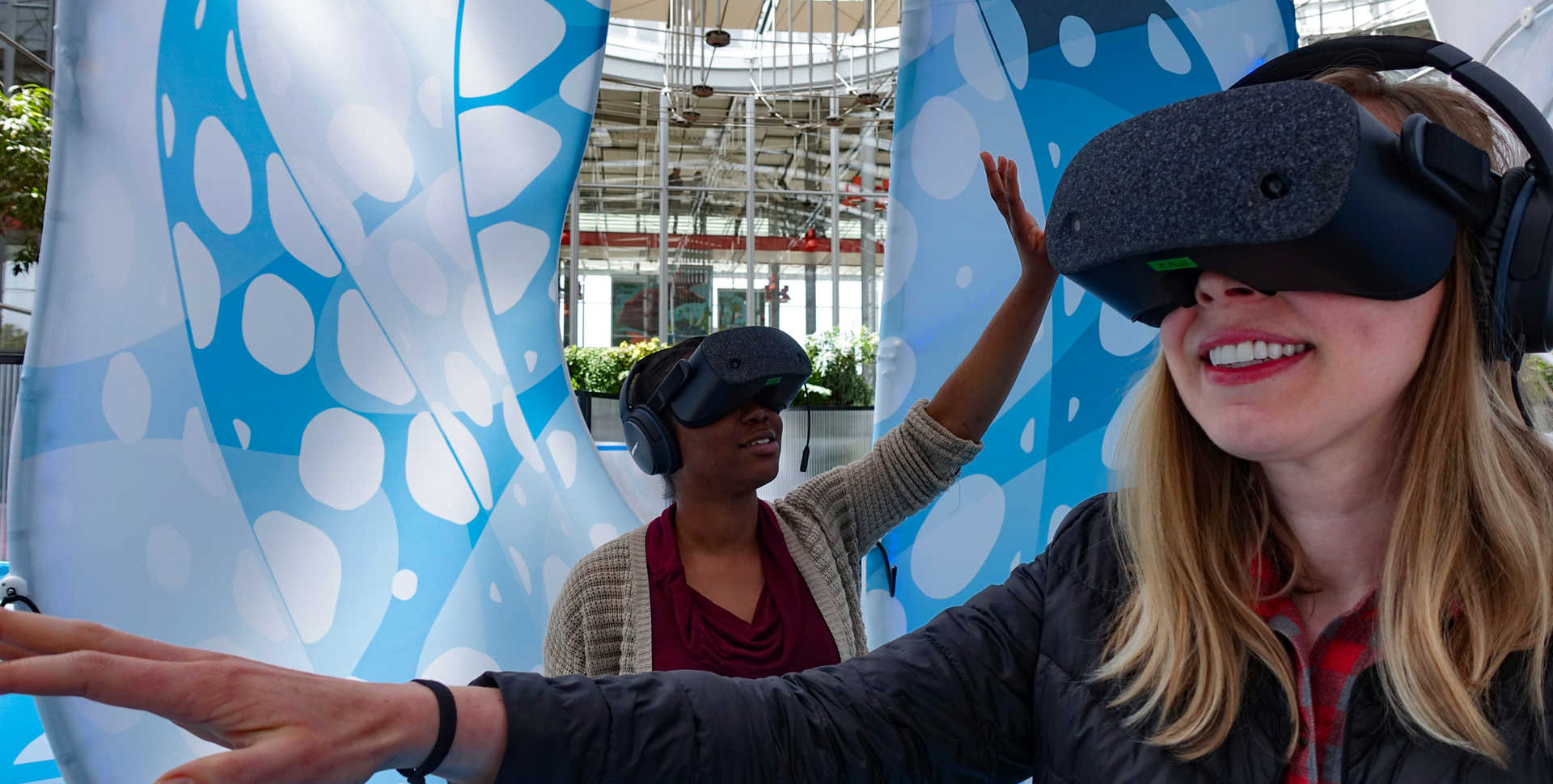 Guests in virtual reality headsets exploring Drop in the Ocean