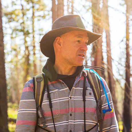 Portrait of Academy curator Jack Dumbacher in the Caples Creek watershed. Photo by Gayle Laird
