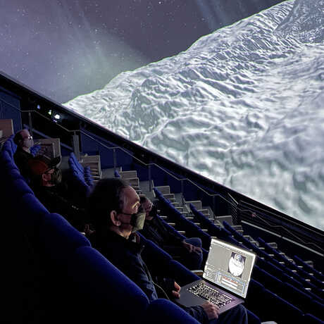 Technicians reviewing dailies in the planetarium