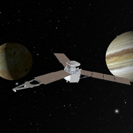 Juno spacecraft with the moon Io (left) and planet Jupiter (right) in the background