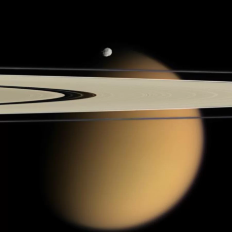 Titan with foreground Rings and minor moon of Saturn