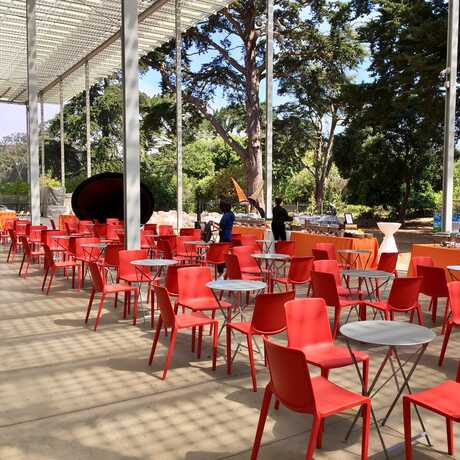 East Garden terrace with red chair setup