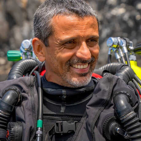 Luiz Rocha wearing rebreather dive gear and smiling 