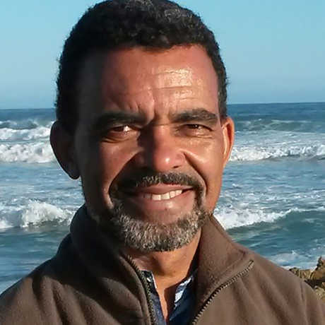 Dr. David Obura in front of waves