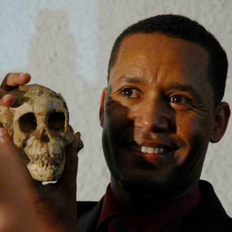 Dr. Zeresenay “Zeray” Alemseged holding Selam skull