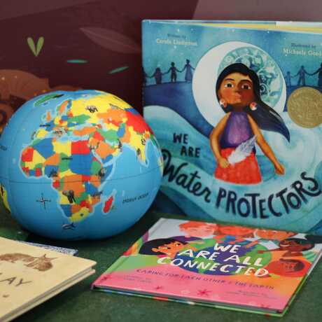Display of toy globe and children's books