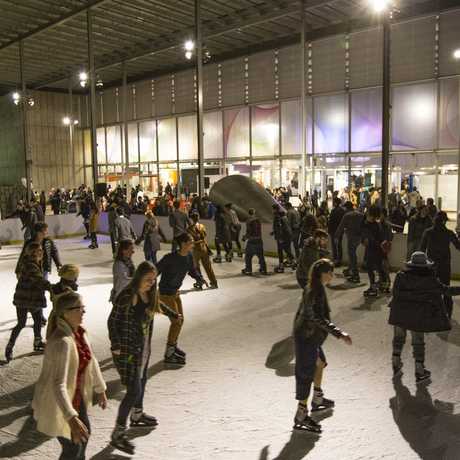 NightLife guests skating at night on the Holiday Ice Rink
