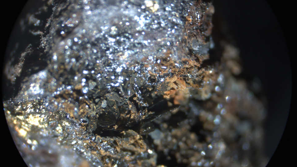 Hematite through a stereo microscope, tlwmdbt/Flickr