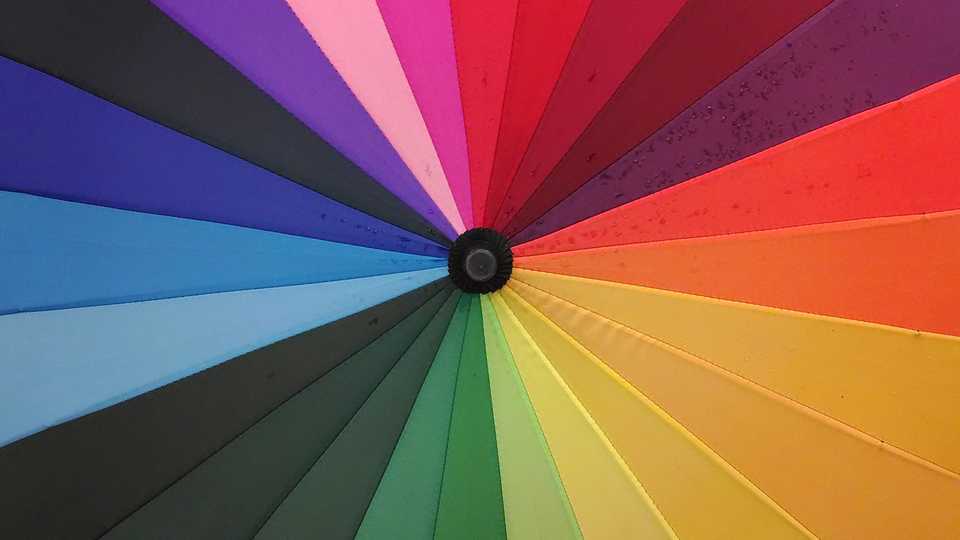 Top view of a rainbow colored umbrella