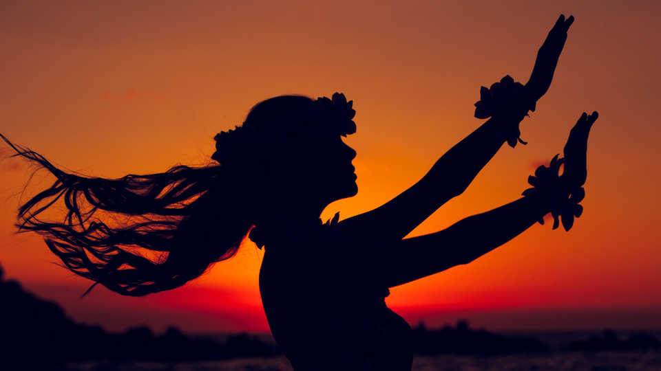 The sun sets on a Polynesian dancer 