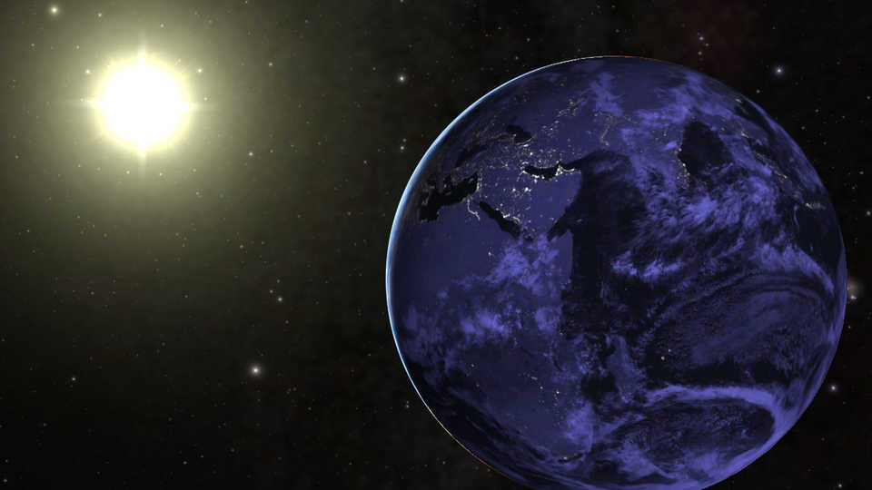 The Earth orbiting the Sun.