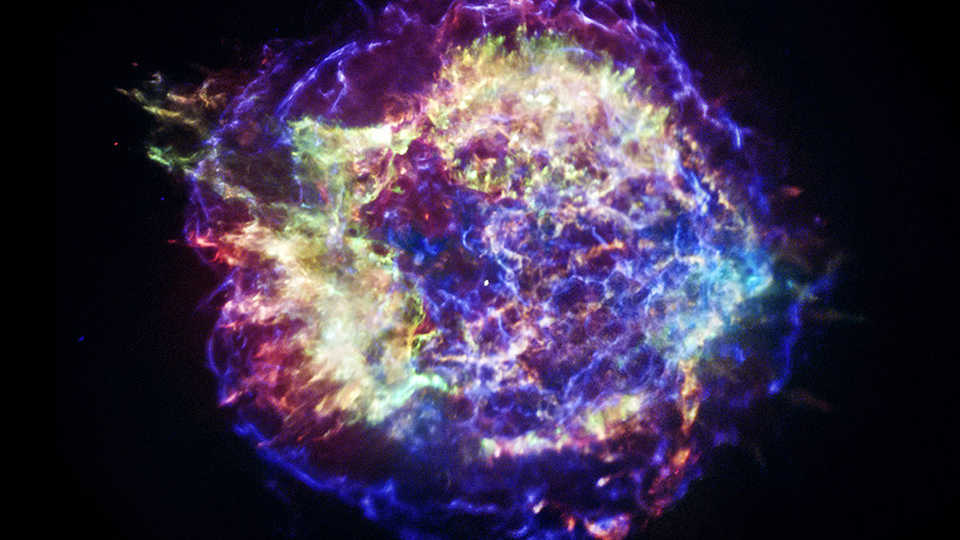 Composite image of supernova remnant Cassiopeia A, combining data from the Hubble, Chandra, and Spitzer space telescopes.